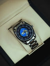 Luxury men's stainless steel world time watch with blue dial in display box at Mens Affair