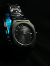 Modern black men's BESTWIN watch with metal strap on dark background, luxury timepiece