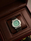 Luxury men’s silver wristwatch with mint green dial, in brown leather display box