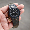Black luxury men's watch with metal band held in hand, modern design, Ministry of Mens Affair