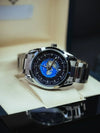 Luxury men’s silver world time watch with blue and black dial on display, Ministry of Mens Affair