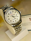Luxury men's silver Rolex watch with diamond hour markers on display stand at Ministry of Mens Affair