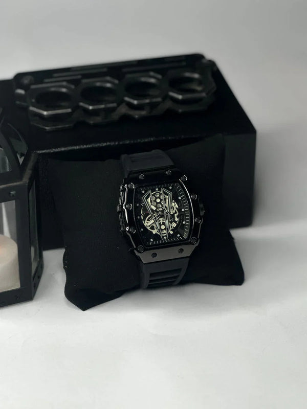 Luxury men's black skeleton watch on display pillow, modern design, Ministry of Mens Affair