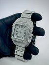 Luxury men's iced-out watch with Roman numerals held by gloved hand, premium modern design