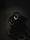 Luxury men's black wristwatch with leather strap on dark background, Ministry of Mens Affair